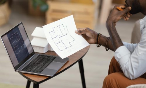 side-view-man-making-plans-redecorate-household(1)
